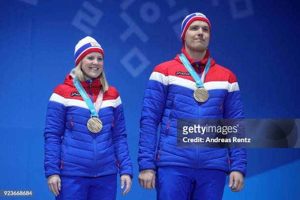 Bronze medal winners Kristin Skaslien and Magnus Nedregotten of Norway celebrate during the medal ceremony for Curling Mixed Doubles on day fifteen...