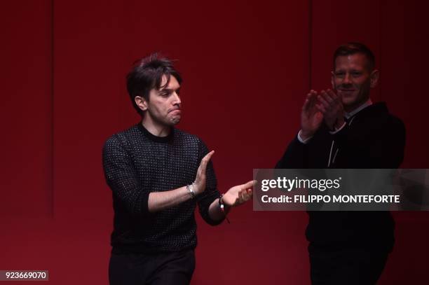 Fashion designers for Salvatore Ferragamo, Guillaume Meilland and Paul Andrew acknowledge the audience at the end of the women's Fall/Winter...