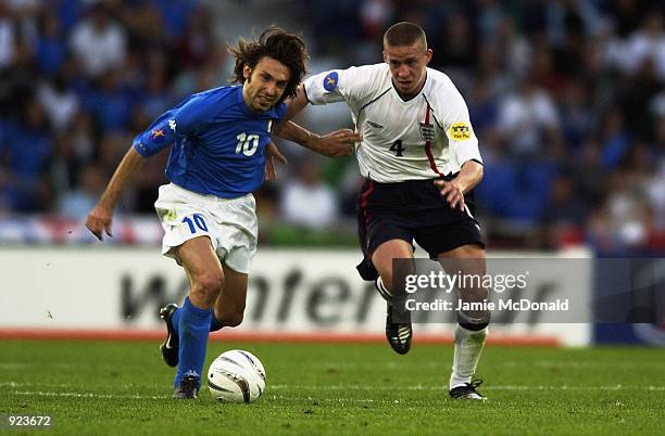 Sean Davis of England closes down Andrea Pirlo of Italy during the 2002 UEFA U21 Championship match between England and Italy held at the St. Jakob...