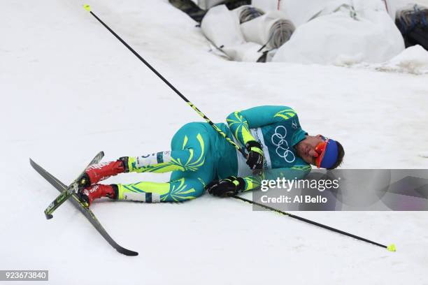 Alexey Poltoranin of Kazakhstan falls after the Men's 50km Mass Start Classic on day 15 of the PyeongChang 2018 Winter Olympic Games at Alpensia...