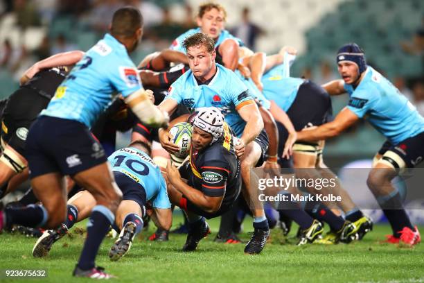 Nizaam Carr of the Stormers is tackled during the round two Super Rugby match between the Waratahs and the Stormers at Allianz Stadium on February...