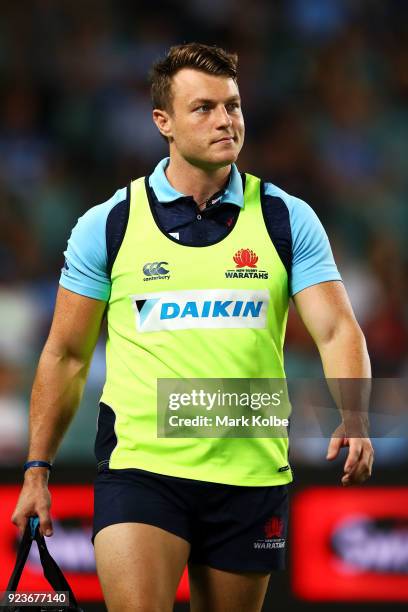 Injured Waratahs player Jack Dempsey of carries the water for his team mates during the round two Super Rugby match between the Waratahs and the...