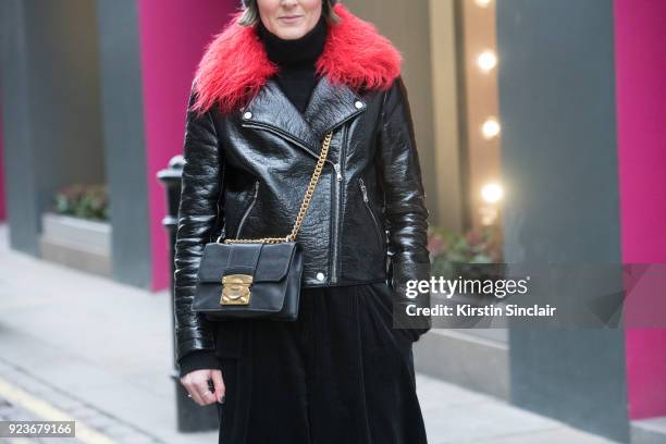 Stylist and editor Steph Wilson wears a Shrimps jacket, And Other Stories trousers and a Miu Miu bag on day 5 of London Womens Fashion Week...