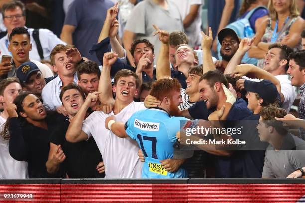 Harry Johnson-Holmes of the Waratahs celebrates with the crowd after victory in debut match during the round two Super Rugby match between the...
