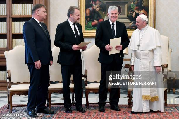 Pope Francis smiles as he meets the three members of Bosnia's tripartite presidency Mladen Ivanic , Bakir Izetbegovic , and Dragan Covic during a...