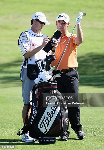 Chez Reavie takes a club from his bag during the third round of the Frys.com Open at Grayhawk Golf Club on October 24, 2009 in Scottsdale, Arizona.