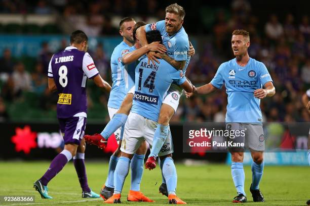Luke Brattan of Melbourne congratulates Daniel Arzani after scoring a goal during the round 21 A-League match between the Perth Glory and Melbourne...