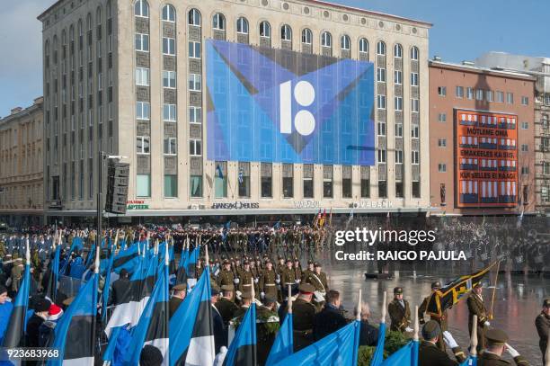 Military officers march passing by Estonia's Prime Minister Juri Ratas , Chief of Estonian Army Riho Terras and Estonia's President Kersti Kaljulaid...