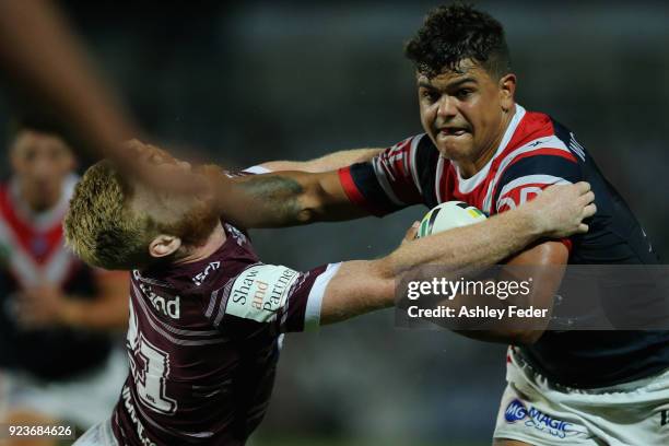 Latrell Mitchell of the Roosters is tackled by the Sea Eagles defence during the NRL Trial match between the Manly Sea Eagles and the Sydney Roosters...