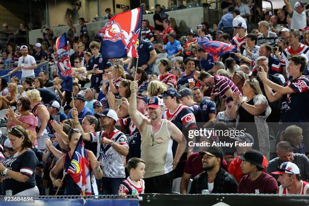 Roosters fans celebrate the win during the NRL Trial match between the Manly Sea Eagles and the Sydney Roosters at Central Coast Stadium on February...