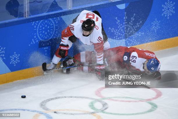 Canada's Marc-Andre Gragnani and Czech Republic's Lukas Radil fight for the puck in the men's bronze medal ice hockey match between the Czech...