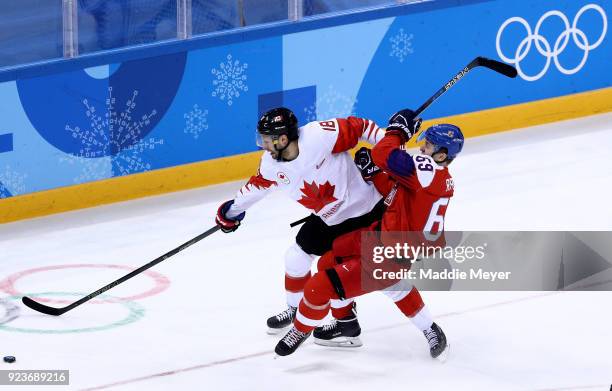 Lukas Radil of the Czech Republic collides with Marc-Andre Gragnani of Canada in the first period during the Men's Bronze Medal Game on day fifteen...