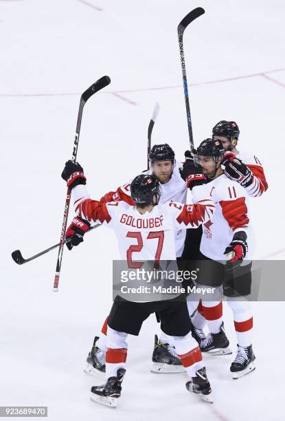 Chris Kelly of Canada celebrates with teammates after scoring his team's second goal in the first period against Czech Republic during the Men's...