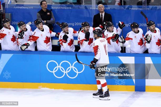 Chris Kelly of Canada celebrates with teammates after scoring his team's second goal in the first period against Czech Republic during the Men's...