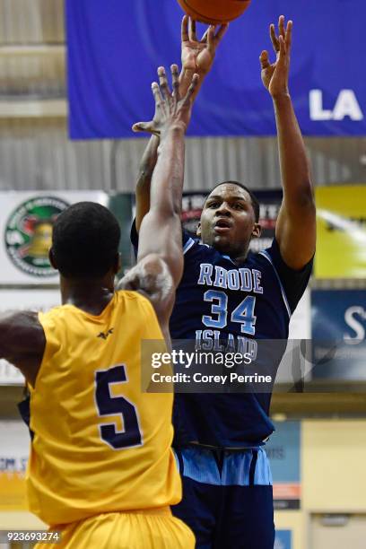 Andre Berry of the Rhode Island Rams shoots the ball against Tony Washington of the La Salle Explorers during the first half at Tom Gola Arena on...