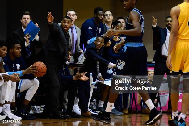 Graduate manager Chris Martin of the Rhode Island Rams signals possession in favor of his team against the La Salle Explorers during the first half...