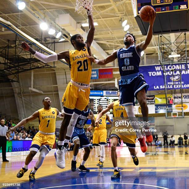 Johnson of the La Salle Explorers defends against E.C. Matthews of the Rhode Island Rams during the first half at Tom Gola Arena on February 20, 2018...