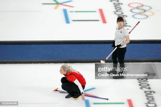 Yurika Yoshida of Japan watches on as Anna Sloan of Great Britain competes during the Curling Womens' bronze Medal match between Great Britain and...