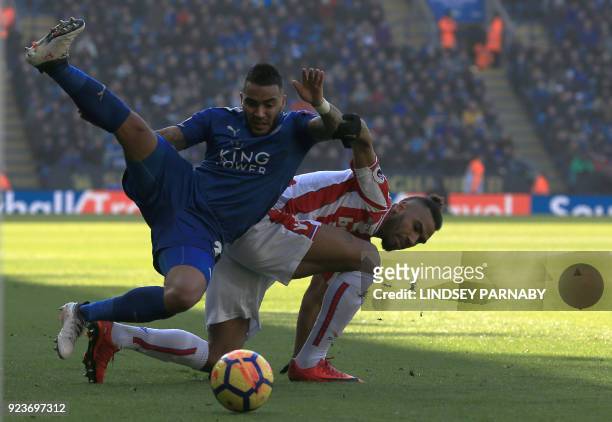 Leicester City's English defender Danny Simpson vies with Stoke City's German midfielder Eric Maxim Choupo-Moting during the English Premier League...