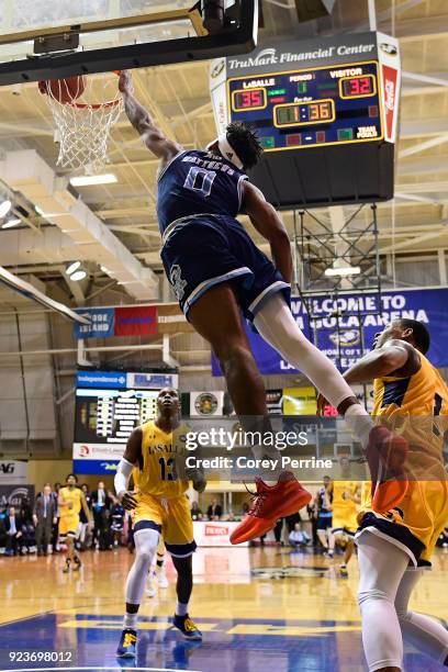 Matthews of the Rhode Island Rams misses the alley-oop after being fouled Amar Stukes of the La Salle Explorers during the first half at Tom Gola...