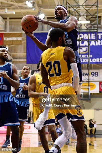 Stanford Robinson of the Rhode Island Rams drives to the basket against B.J. Johnson of the La Salle Explorers during the first half at Tom Gola...