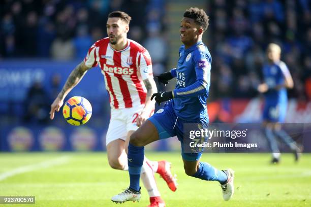 Demarai Gray of Leicester City in action with Geoff Cameron of Stoke City during the Premier League match between Leicester City and Stoke City at...