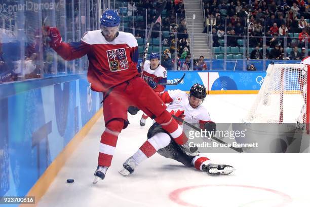 Rob Klinkhammer of Canada collides with Jakub Nakladal of the Czech Republic in the first period during the Men's Bronze Medal Game on day fifteen of...