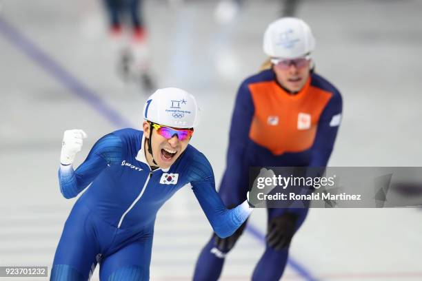 Seung-Hoon Lee of Korea celebrates winning the gold medal as Koen Verweij of Netherlands takes the bronze during the Men's Speed Skating Mass Start...