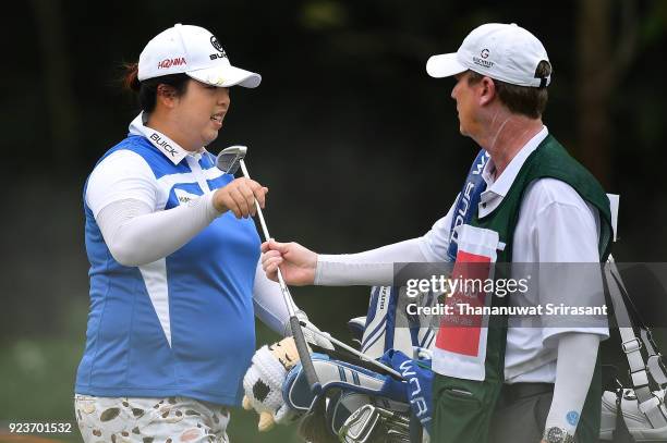 Shanshan Feng of China speaks with her caddy during the Honda LPGA Thailand at Siam Country Club on February 24, 2018 in Chonburi, Thailand.