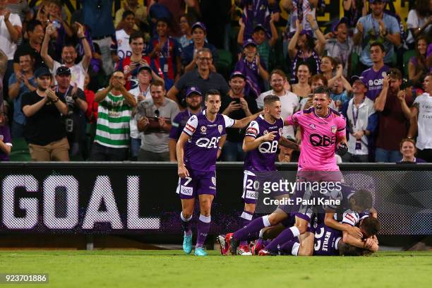 Adam Taggart of the Glory is congratulated by team mates after scoring the winning goal during the round 21 A-League match between the Perth Glory...