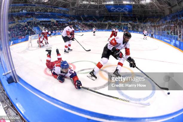 Chris Kelly of Canada controls the puck against Tomas Kundratek of the Czech Republic in the second period during the Men's Bronze Medal Game on day...