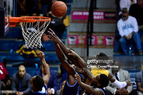 Johnson of the La Salle Explorers vies for the ball against the Rhode Island Rams during the second half at Tom Gola Arena on February 20, 2018 in...