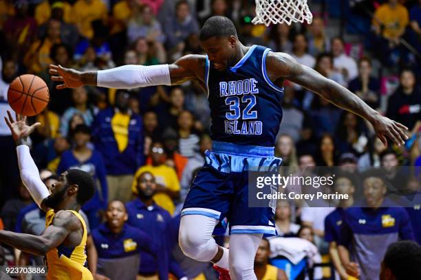 Jared Terrell of the Rhode Island Rams defends against B.J. Johnson of the La Salle Explorers as they fly out of bounds during the second half at Tom...