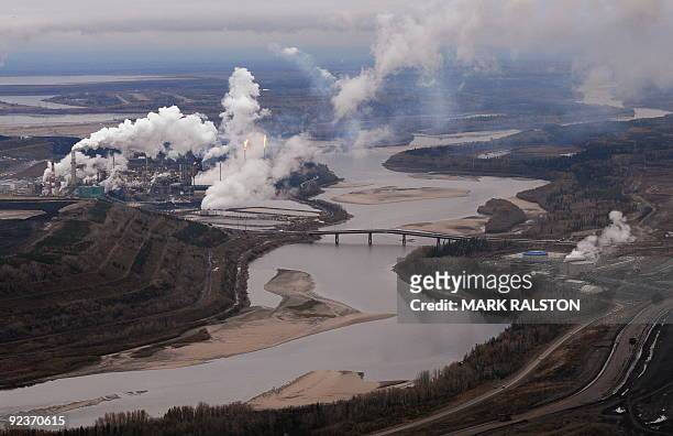 Aerial view of the Suncor oil sands extraction facility on the banks of the Athabasca River and near the town of Fort McMurray in Alberta Province,...