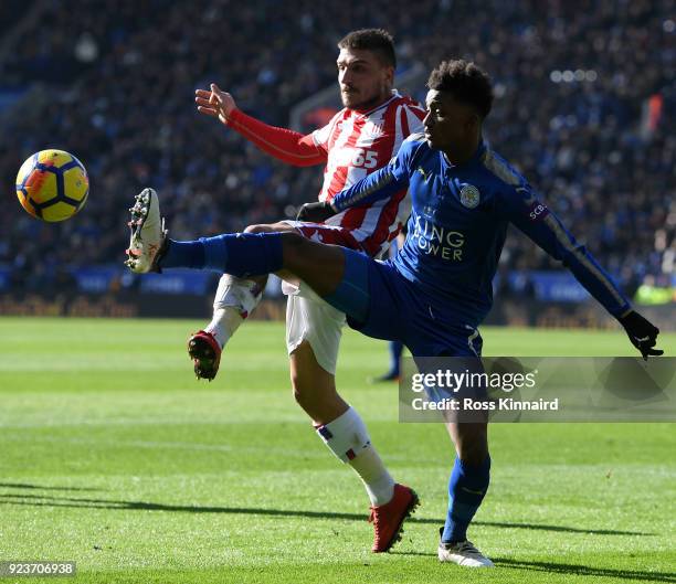 Konstantinos Stafylidis of Stoke City battles for possesion with Demarai Gray of Leicester City during the Premier League match between Leicester...