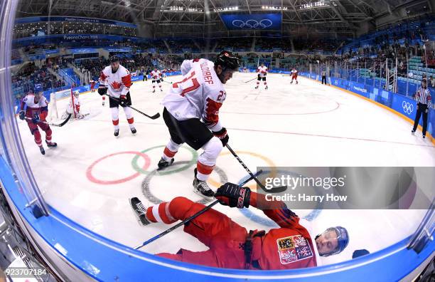 Cody Goloubef of Canada controls the puck against Tomas Zohorna of the Czech Republic in the first period during the Men's Bronze Medal Game on day...