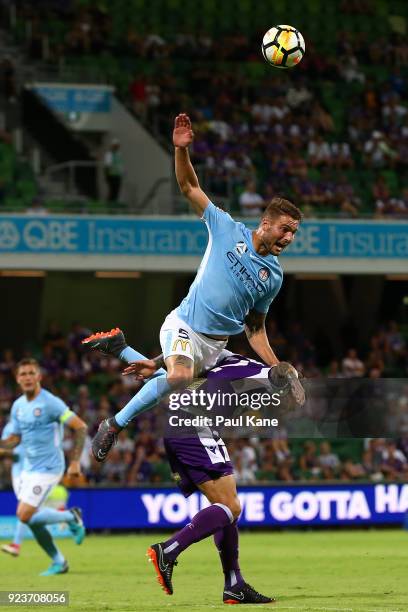 Bart Schenkeveld of Melbourne challenges Andy Keogh of the Glory for the ball during the round 21 A-League match between the Perth Glory and...