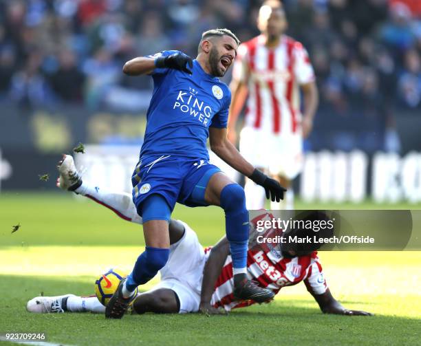 Riyad Mahrez of Leicester is fouled by Maxim Choupo-Moting of Stoke during the Premier League match between Leicester City and Stoke City at The King...