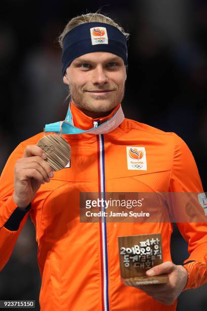 Bronze medalist Koen Verweij of Netherlands celebrates during the medal ceremony after the Men's Speed Skating Mass Start Final on day 15 of the...