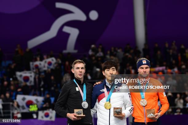 South Korea's Lee Seung-Hoon , Belgium's Bart Swings and Netherlands' Koen Verweij pose on the podium as they celebrate their respective gold, silver...