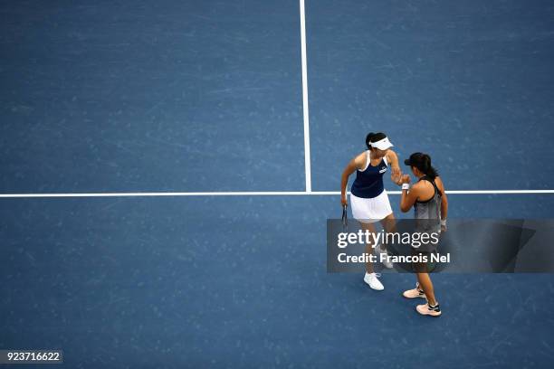 Hao-Ching Chan of Taiwan and Zhaoxuan Yang of China talk tactics during the Women's Doubles Final match on day six of the of the WTA Dubai Duty Free...