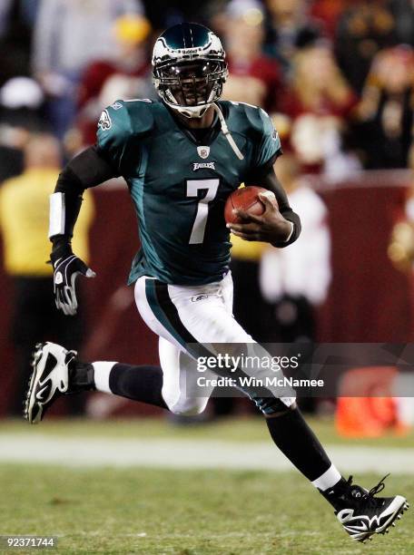 Michael Vick of the Philadelphia Eagles runs the ball against the Washington Redskins at FedEx Field October 26, 2009 in Landover, Maryland. The...