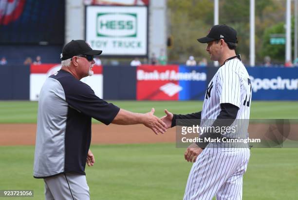 Manager Ron Gardenhire of the Detroit Tigers and manager Aaron Boone of the New York Yankees shake hands during player introductions prior to the...