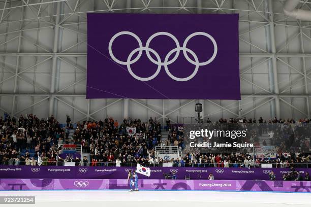 Seung-Hoon Lee of Korea celebrates winning the gold medal with teammate Jaewon Chung of Korea during the Men's Speed Skating Mass Start Final on day...