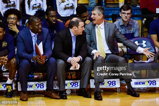 Head coach John Giannini of the La Salle Explorers shares his frustration of the game with assistant coach Sean Neal and assistant coach Horace Owens...