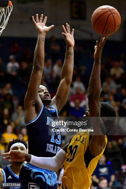 Stanford Robinson of the Rhode Island Rams defends against B.J. Johnson of the La Salle Explorers during the second half at Tom Gola Arena on...