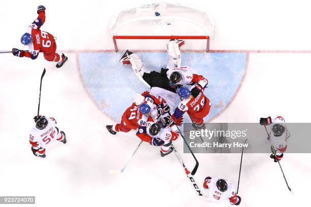 Tomas Kundratek and Tomas Zohorna of the Czech Republic compete for the puck against Maxim Lapierre, Chay Genoway and Kevin Poulin of Canada in the...