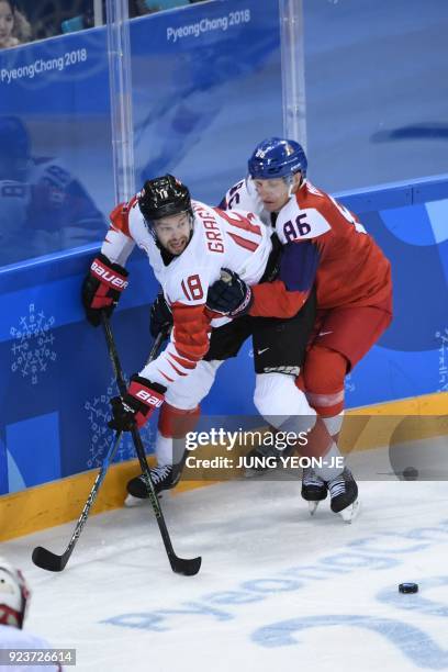 Canada's Marc-Andre Gragnani fights for the puck with Czech Republic's Tomas Mertl in the men's bronze medal ice hockey match between the Czech...