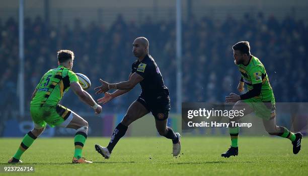 Olly Woodburn of Exeter Chiefs looks to break past Harry Mallinder of Northampton Saints during the Aviva Premiership match between Exeter Chiefs and...