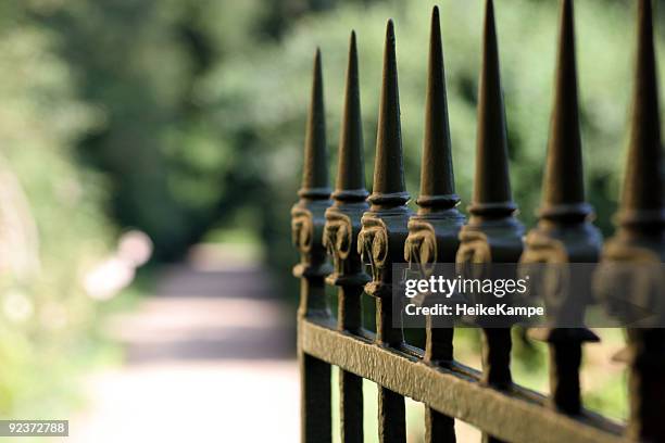 the entrance - metal fence stock pictures, royalty-free photos & images